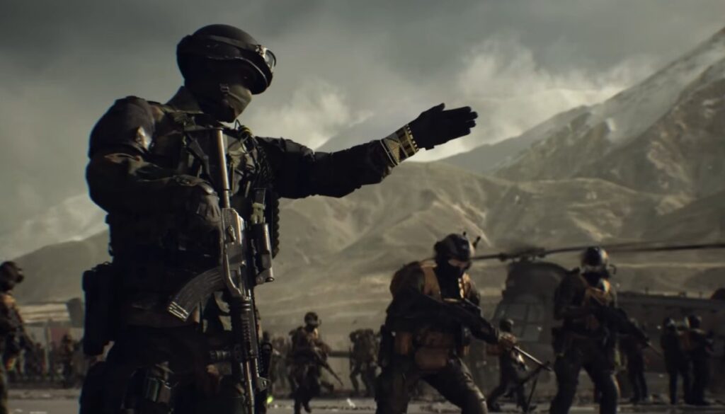 A soldier from Battlefield 6 in tactical gear gestures while a team prepares for action in a dramatic mountainous landscape.